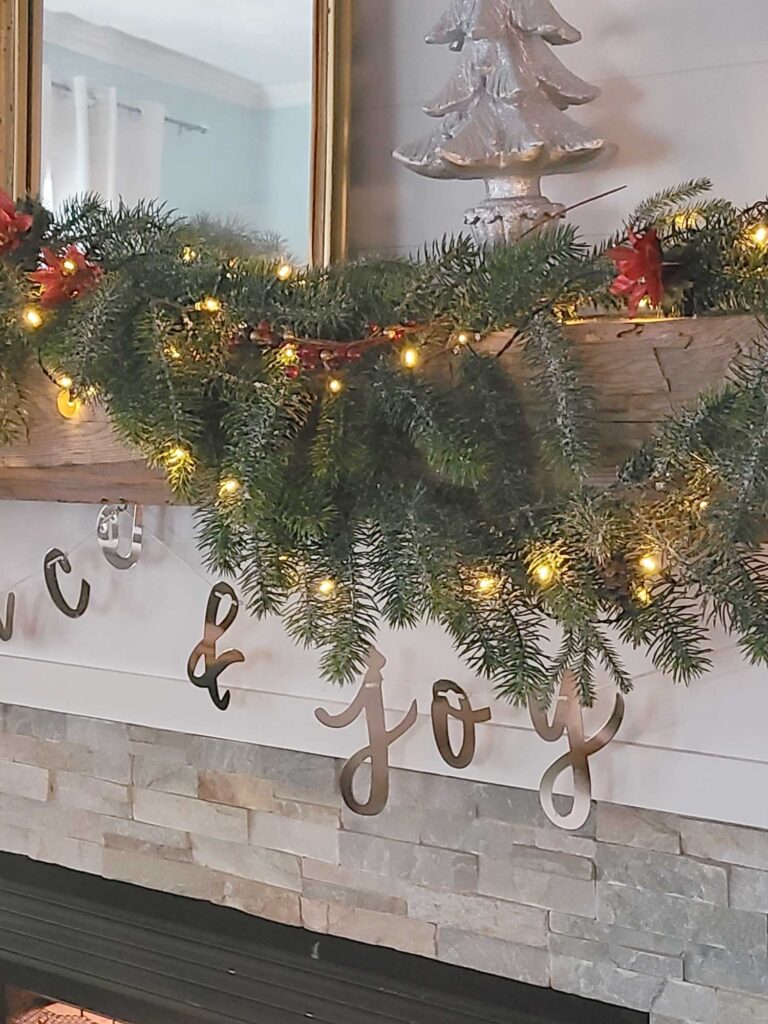 Christmas mantle decorated with greenery
